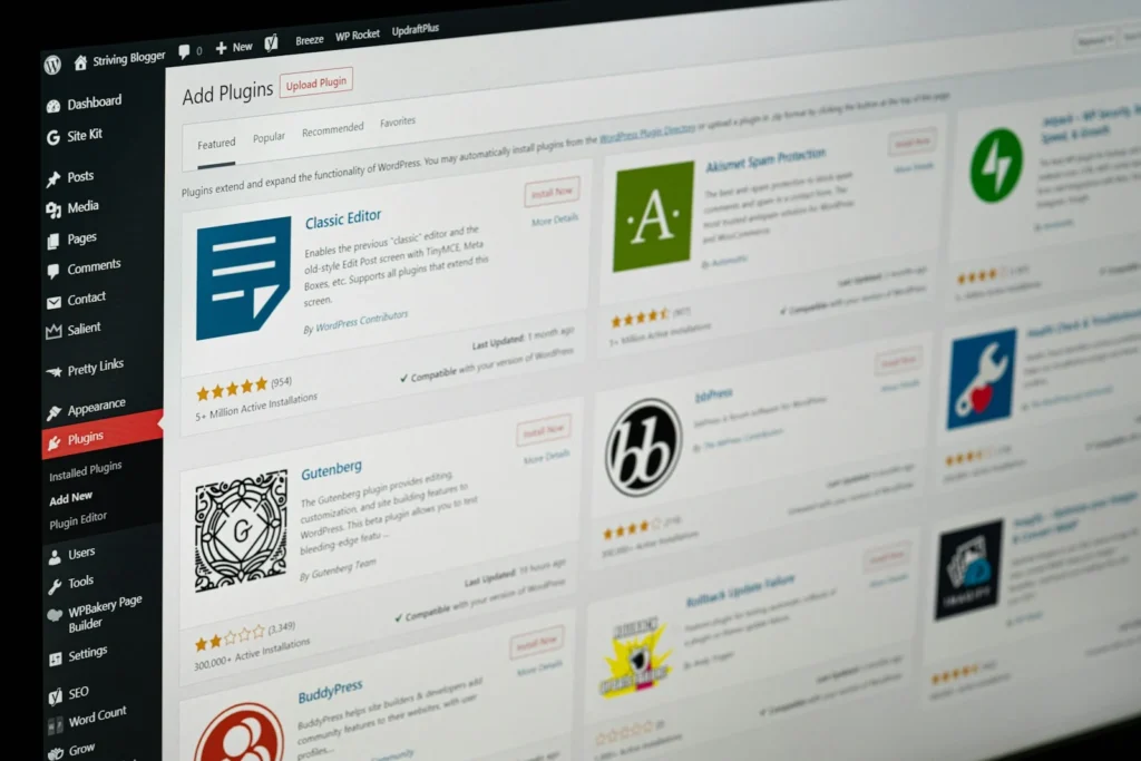 WordPress admin screen showing plugins on a monitor